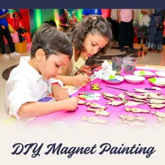 Little hands, big creativity! These children are enjoying the DIY magnet painting station, where they can paint pre-cut wooden shapes that they can later display on their fridges at home.
