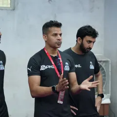 Briefing the team before a session. Clear communication is essential to ensure everyone is aligned and ready to get to work.