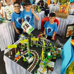 Team 'Lego Wizards' presenting their 'Festivals of India' project. This interactive model uses LEGO WeDo to showcase different cultural celebrations with moving parts and lights.
