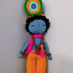Another beautiful Lord Krishna doll I made. He has his flute, a necklace, and a peacock feather in his hair.
