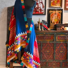 Another view of the tribal chadar, showcasing its beautiful drape against a backdrop of restored art. The piece is finished with a custom trim made from my ever-growing collection of waste fabric.