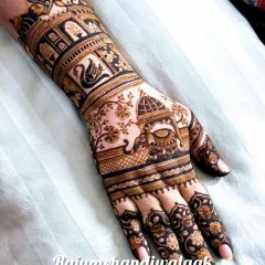This design incorporates a majestic elephant and a graceful swan into the wristband. These custom elements are woven into a larger traditional pattern featuring palace architecture.