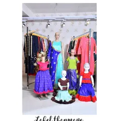 A view of my showroom with various traditional and modern outfits on display.
