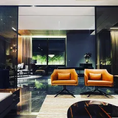 An interior view of a residence at Palam Vihar, where the exterior lighting is visible through the windows. This demonstrates my holistic approach, ensuring the outdoor illumination enhances the indoor experience and view.