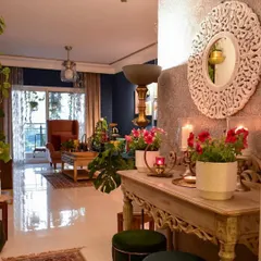 One of my favorite places in my home is the foyer. This look features flowering plants on the console table, adding a pop of color and freshness to the entrance.
