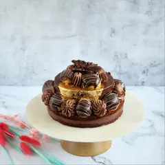 Indulge in the Desire 3 Cake. We've reconstructed this recipe for those who prefer their cakes less sweet. It features rich Saint Domingue dark couverture chocolate, a delicate chocolate dacquoise, and is garnished with 99% pure gold varak for a touch of luxury.