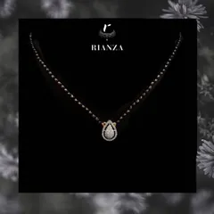 This elegant mangalsutra features a pear-shaped diamond pendant. It is a simple yet beautiful statement that a modern married woman can comfortably wear every day.