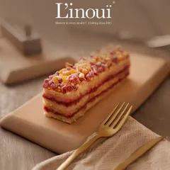 This is our eggless raspberry pastry. You can see the distinct layers of light cake, pure dairy cream, and tangy raspberry compote, all meticulously assembled for a perfect bite every time.