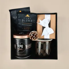Another version of our "Cozy at Home" gift hamper, with premium coffee, gourmet popcorn, and a beautiful mug, perfect for a relaxing evening.