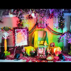 For this Guruji Satsang, the theme was yellow and green. I used drapes and marigold garlands to create a bright backdrop, with a dense floral canopy overhead and spotlights to highlight the Aasan.