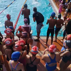 A quick team huddle between races. I use these moments to discuss strategy, give encouragement, and make sure everyone is focused. The team spirit was amazing all weekend.