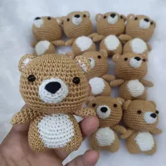 A close-up of one of the teddy bear keychains, with the rest of the batch in the background. The consistent quality in each bear is something I take great pride in.