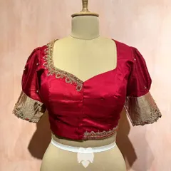 A full view of the maroon puff-sleeve blouse, perfect for moments that call for quiet sophistication.