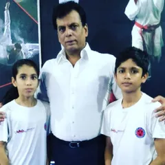 My champions with the esteemed Hanshi Bharat Sharma, a senior figure in the world of karate. It is important for my students to learn from and show respect to the masters of the art.