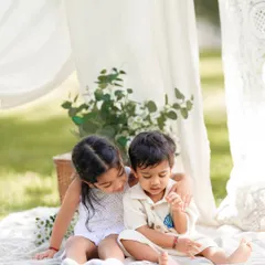 The gentle bond between a big sister and her little brother. My goal is to capture these quiet, unposed interactions that truly define your family's love.