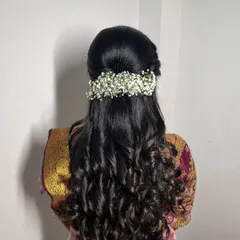 A detailed shot of a beautiful bridal hairstyle created by one of the talented hairstylists I collaborate with. This half-up, half-down style with baby's breath is romantic and timeless.