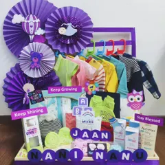A gift from the grandparents, this 'Nani Nanu' hamper is filled with love. The purple theme and signs like 'Keep Growing' and 'Stay Blessed' add a personal, heartfelt touch.