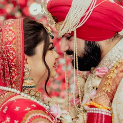 In the quiet moments before the world sees you as one, we find the purest expressions of love. This intimate close-up captures the unspoken promises and deep affection between a bride and groom, their faces close, lost in their own world.