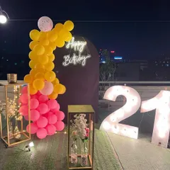 Another angle of the 21st birthday rooftop decor, highlighting the city view in the background which adds to the ambiance.