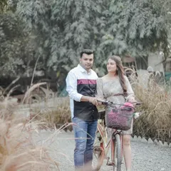 A casual moment captured in our natural outdoor area. The vintage bicycle prop adds a touch of whimsy to this sweet couple's portrait.