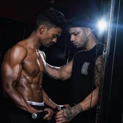 A moment of intense focus during a workout. My role is to push my clients beyond their limits while ensuring their technique is flawless.