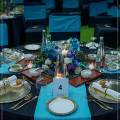 An elegant tablescape at the India Energy Week, featuring our signature blue and gold theme. We design sophisticated dining environments for major international conferences and summits.