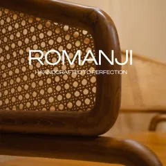 The 'Romanji' bench, handcrafted from premium teak wood. The rattan backrest and curved handrests offer unmatched comfort and style for any indoor space.