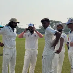A moment of camaraderie between players during a break in play at the JP Atray Tournament. While the competition is fierce, the spirit of sportsmanship and teamwork is always paramount.