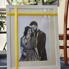 The finished couple portrait, framed and ready to be gifted. I offer simple, elegant framing options to complement the artwork and make it ready to display.