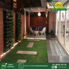 The right lighting transforms a garden into a 24/7 usable space. This night view of our courtyard project highlights the ambient lighting we installed along the vertical garden base, creating a warm and inviting atmosphere for evening relaxation.