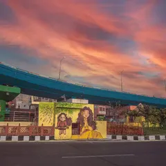 Finding beauty in urban landscapes. This shot from Agra captures vibrant local street art, combining it with a dramatic sunset to create a compelling urban photograph.