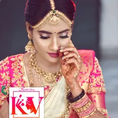 This is a classic South Indian bridal look. The makeup is kept natural and radiant to highlight her features, paired with a traditional hair bun and beautiful gold jewellery. The pink Kanjeevaram saree completes this timeless look.