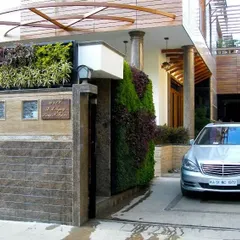 A closer look at how our vertical garden design enhances a home's curb appeal. The mix of plant colors and textures on the facade creates a living piece of art that welcomes you home while actively cleaning the air.