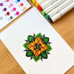 A simple yet vibrant colored mandala created with alcohol markers. This piece shows how a few complementary colors can create a beautiful and balanced design.