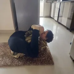 This client is working on a deeper variation of a hip-opening pose during her home session. My personalized approach ensures that every student, regardless of age, can progress safely at their own pace.