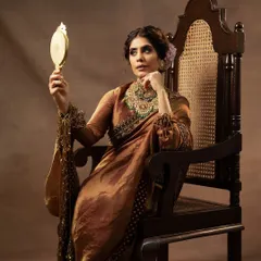 This portrait, shot for a collaboration between Jayanti Reddy Label and Kishandas Jewellery, is all about capturing a mood of regal elegance. I used soft, directional lighting to sculpt the model's features and bring out the rich textures of the silk saree and the exquisite detail of the heritage jewellery.