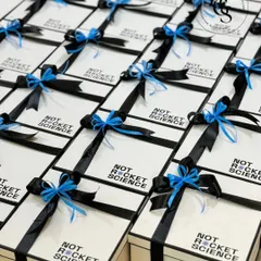 These sleek, custom-branded boxes for 'Not Rocket Science' show how a simple, strong design can make a powerful statement. I handle bulk orders for corporate events, ensuring every gift is perfectly aligned with your brand's message and delivered with precision.