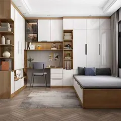 This design shows a complete room solution with a bed, wardrobe, and study desk all integrated into one wall of custom furniture. This approach is perfect for maximizing floor space in a smaller bedroom or studio apartment.
