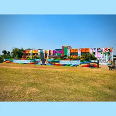 A full view of the massive mural project in Ratu, Jharkhand. The entire building was transformed with colorful art, telling a story of community and hope. This shows the before-and-after impact of large-scale art.