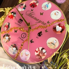 Celebrate every precious moment with a custom baby clock. This bright pink resin clock features twelve photos from baby Shanayra's first year, along with her birth details, making it a perfect centerpiece for a nursery.