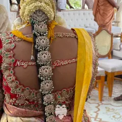 The personal touch of Bhavana's blouse, with the bride and groom's names embroidered on the back.