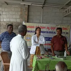 Discussing a case during the free skin camp. It was a collaborative effort with the Bangalore Dermatology Society to provide comprehensive care.