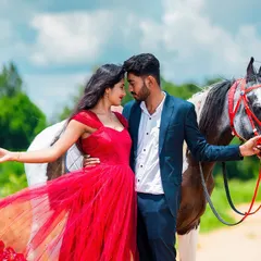 A fairytale pre-wedding moment captured in a vibrant, cinematic style. The flowing red dress against the lush green landscape and the presence of a beautiful horse adds a touch of epic romance.