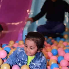 A moment of pure joy diving into a sea of colorful balls. Our ball pit is a favorite for kids of all ages, perfect for jumping, hiding, and imaginative play.