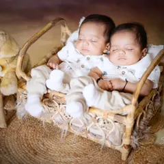 Two precious hearts sleeping side by side. This newborn twins photoshoot captures the special bond between siblings from their very first days.
