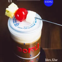 This unique cocktail from Idoru is presented in a branded can with a fun garnish. The photo highlights the creative presentation, which is a key selling point for a modern cocktail bar. The dark, moody lighting adds to the bar's vibe.