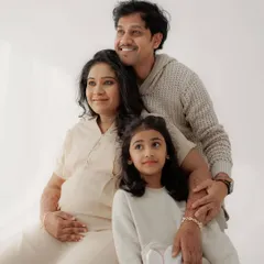 A happy family portrait celebrating their new beginning. I kept the makeup for the mom-to-be very natural and radiant to match the bright, airy feel of the studio photoshoot.