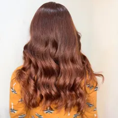 This chocolate brown transformation is pure magic. We gave her a glossy, dimensional color styled with soft waves.