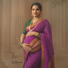 Dressed in a vibrant purple Mysore silk saree, this portrait captures the regal elegance and quiet strength of a mother-to-be.