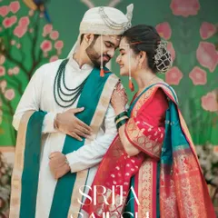 A romantic portrait of a Maharashtrian couple against a beautifully painted backdrop. We love incorporating unique decor and vibrant colors to create stunning, memorable wedding photos.